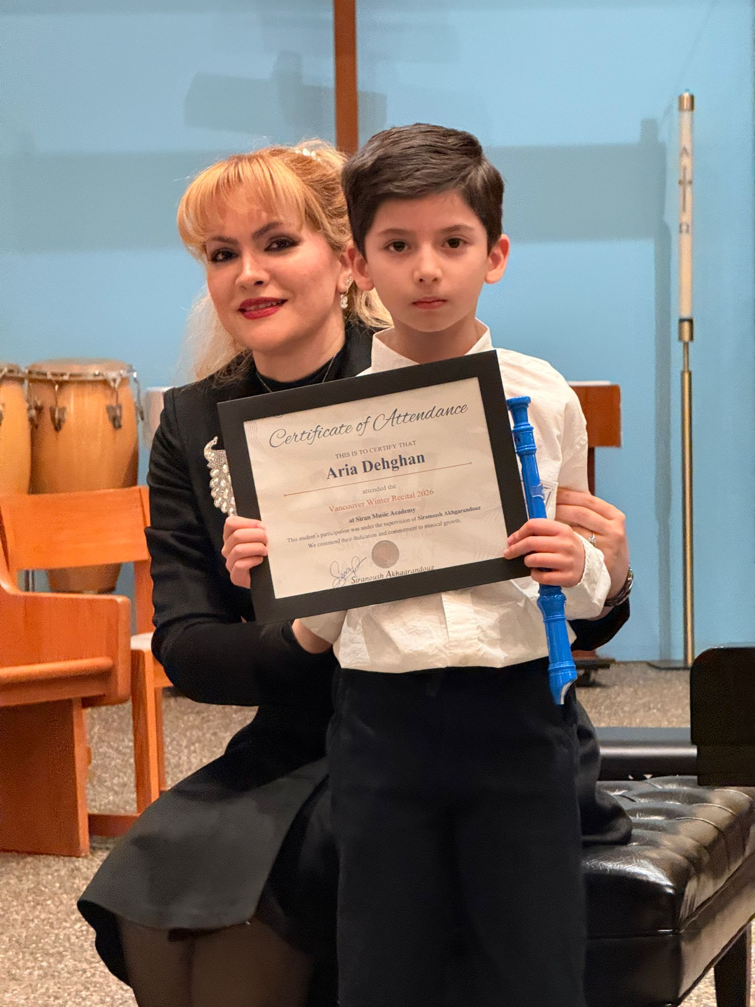 Aria Dehghan with recorder and certificate