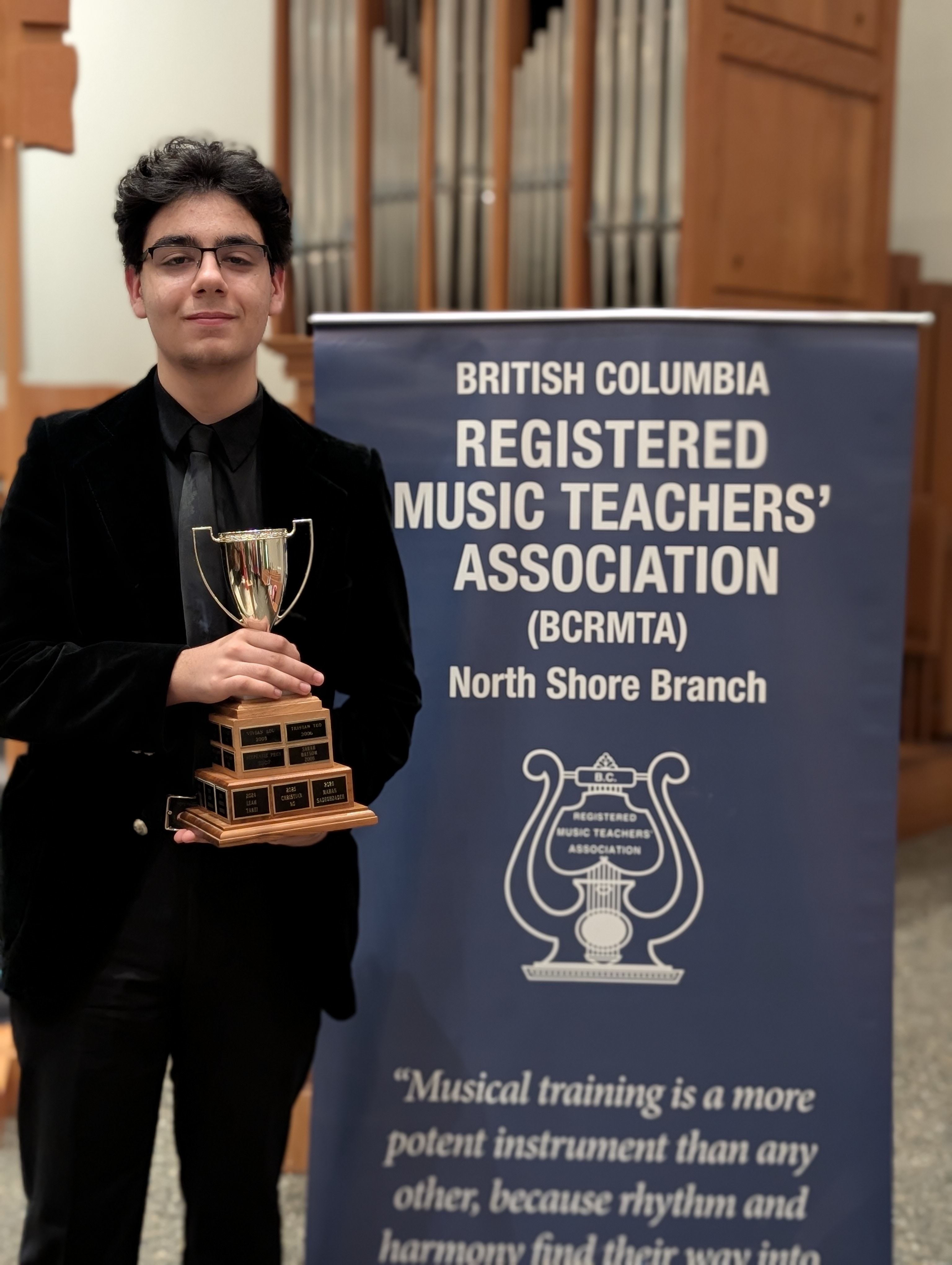 Mahan Sadeghzadeh with competition trophy